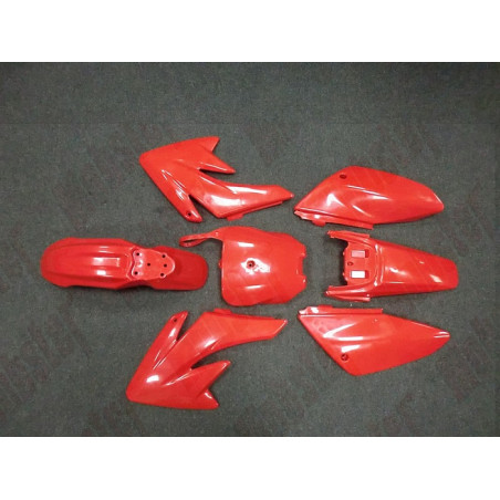 KIT PLASTICHE PIT BIKE COMPLETO B2/CRF70 COLORE ROSSO. COMPLETE DI TUTTO, GOMMINI PER MONTAGGIO